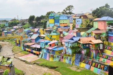 Malang, 07 Desember 2022 - View of Colorful Jodipan village (Kampung Warna Warni Jodipan) seen from the Brantas river bridge. Malang, East Java, Indonesia