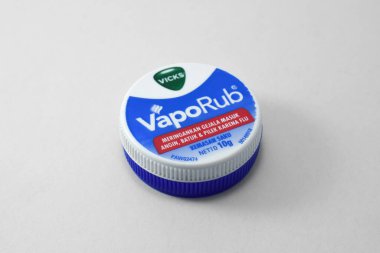 Pasuruan, 03 Desember 2022 - Closeup on bottle of vicks vaporub. It is a medicinal balm for treating small respiratory diseases. Vicks VapoRub ointment is a mentholated topical cream