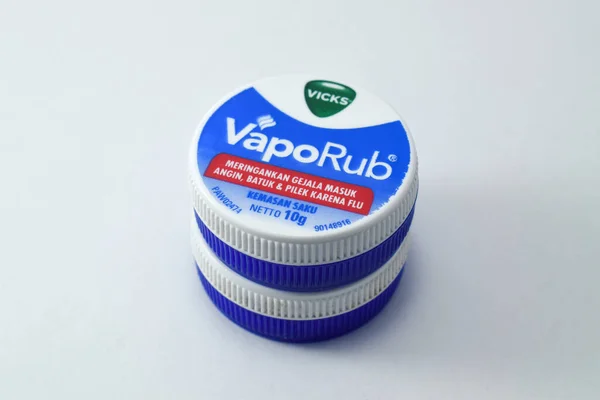 Pasuruan, 03 Desember 2022 - Closeup on bottle of vicks vaporub. It is a medicinal balm for treating small respiratory diseases. Vicks VapoRub ointment is a mentholated topical cream