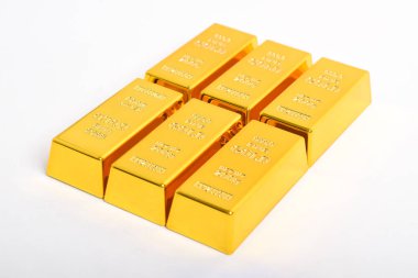 Beyaz arkaplan, Finansal Konseptler ve İş Dünyasında izole edilmiş altın külçeleri.