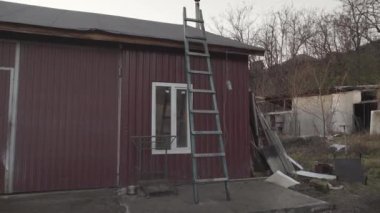 The old wooden staircase leaning against a building. High quality FullHD footage