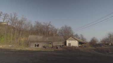 Old truck on front of an old building. High quality FullHD footage