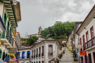 Ouro Preto, MG, Brazil - 01.08.23: colored facade and porches of ancient buildings of colonial city.
