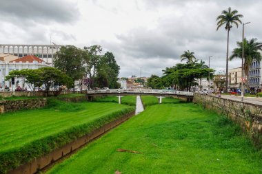 narrow stream, old bridge and ancient architecture of Sao Joao del Rei, Minas Gerais state, Brazil.