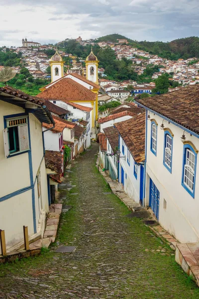 Ouro Preto, MG, Brazil: street slope and ancient buildings of colonial city.