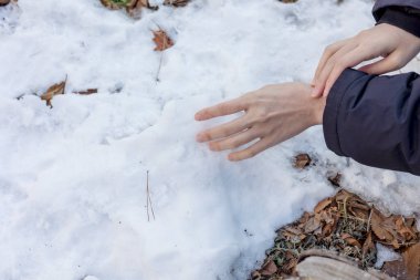 Woman is touching snow