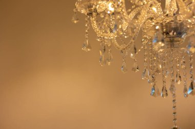 The crystal chandelier lighting up the room