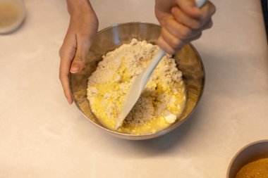 Making hotteok dough before baking, whip and mixture into a paste by hands