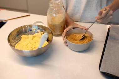 Making hotteok dough before baking, whip and mixture into a paste by hands