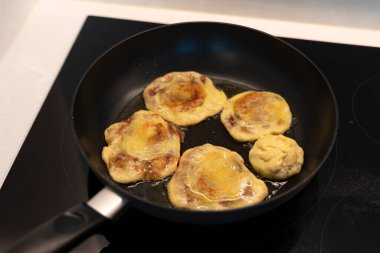 Frying hotteok on the greased pan
