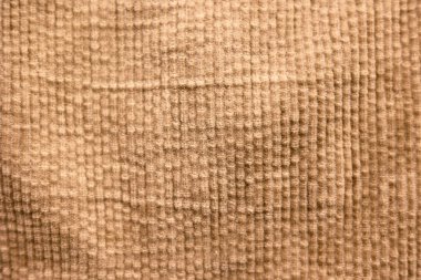 The texture of corduroy in beige brown color