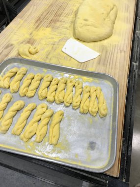 Making Korean Kkwabaegi, the dough of twisted bread stick on the table