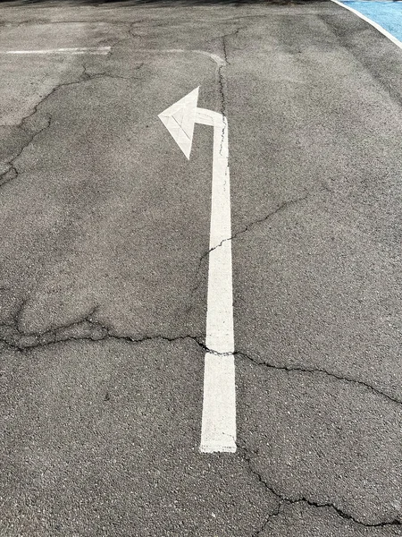Left arrow on the road