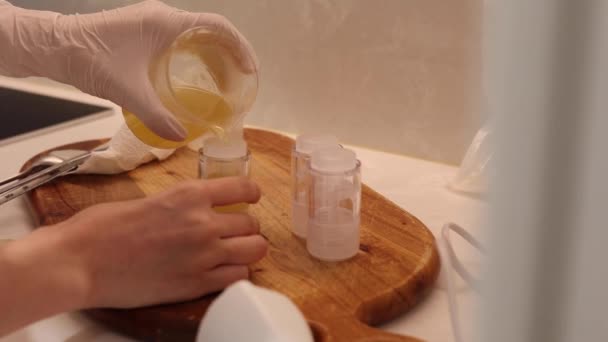 Gloved Hands Pouring Jojoba Oil Cosmetic Empty Bottles Laboratory — Vídeo de Stock