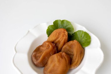 White plate of Dried Persimmon on the white background