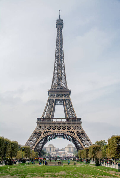 view of the Eiffel tower walking through Paris. High quality photo