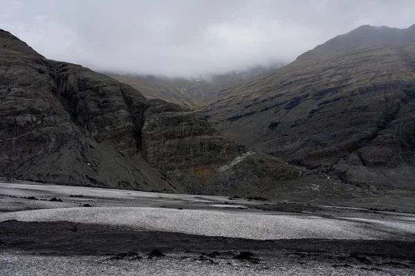 Icelandic mountains hidden by clouds