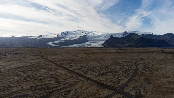 Icelandic lake between mountains and glaciers