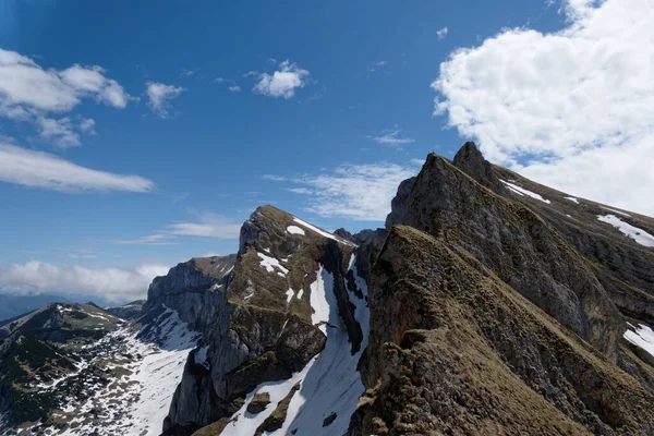 the mountain peaks in the snow