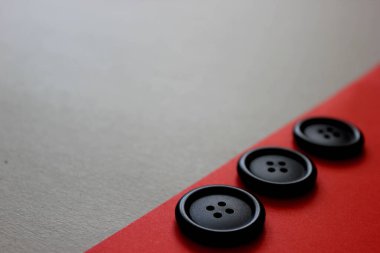 Black buttons on red background