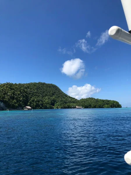 the view of the sea with the mountains 