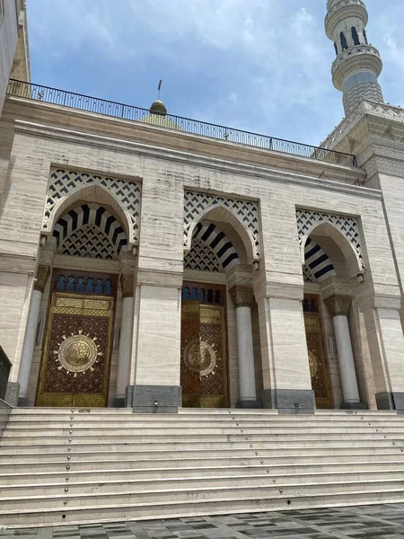 the entrance of the mosque and the city of the old building