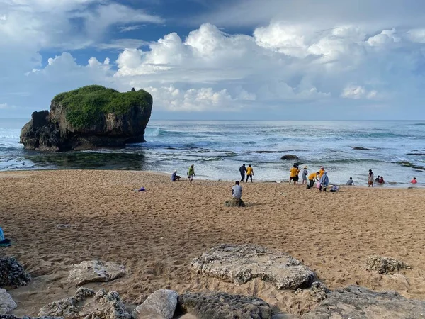 Playing at tropical south Indonesia beach