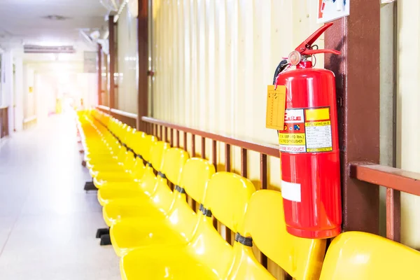 Fire extinguishers are available in fire emergencies.Fire extinguisher system on the wall.Emergency equipment for industrial factory or hospital corridor.Security system concept.Empty hotel corridor.