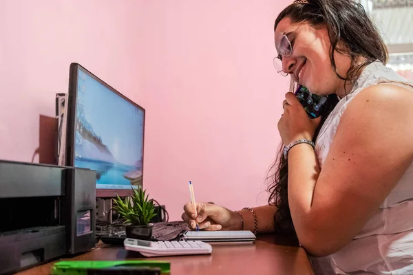 secretary making online purchases with a credit card in the office