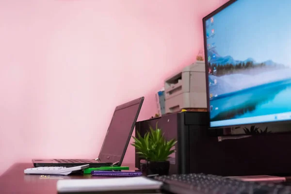 secretary making online purchases with a credit card in the office