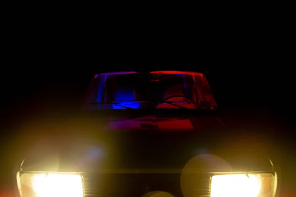 stock image red car headlights on black background