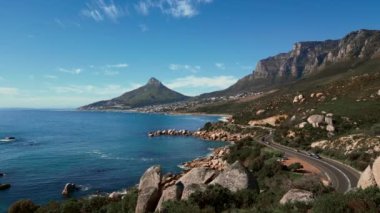 Aerial footage of the mountain (Lions Head) with seafront