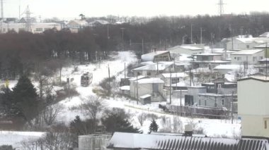 Hokkaido, Japan - January 24, 2023: A diesel-powered vehicle for Nemuro station running in snow.