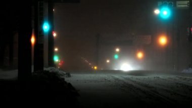 Hokkaido, Japan - January 24, 2023: A car running under heavy snow and strong wind at midnight in Nemuro, Hokkaido, Japan 
