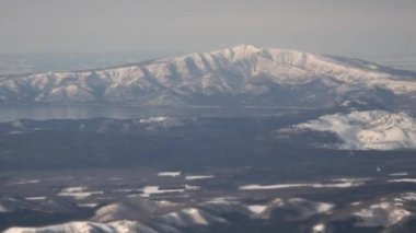 Hokkaido, Japan - January 23, 2023:Aerial view of Lake Kussharo and Lake Mashu in winter, Hokkaido, Japan