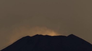Tokyo, Japan - January 29, 2023: The peak of Mt. Fuji just after the sunset in winter, Tokyo, Japan