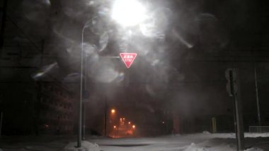 Hokkaido, Japan - January 24, 2023: Heavy snow and strong wind on a street at midnight in Nemuro, Hokkaido, Japan