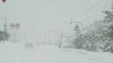 Hokkaido,Japan - February 26, 2023: Street View in heavy snow in Furano, Hokkaido, Japan