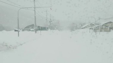 Hokkaido,Japan - February 26, 2023: Street View in heavy snow in Furano, Hokkaido, Japan