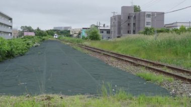 Hokkaido, Japonya - 9 Temmuz 2024: Wakkanai, Japonya 'dan geçen Bakkai demiryolu geçidi