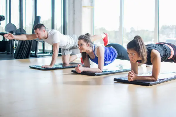 Group Young Sporty People Exercising Together Gym — Stock Photo, Image