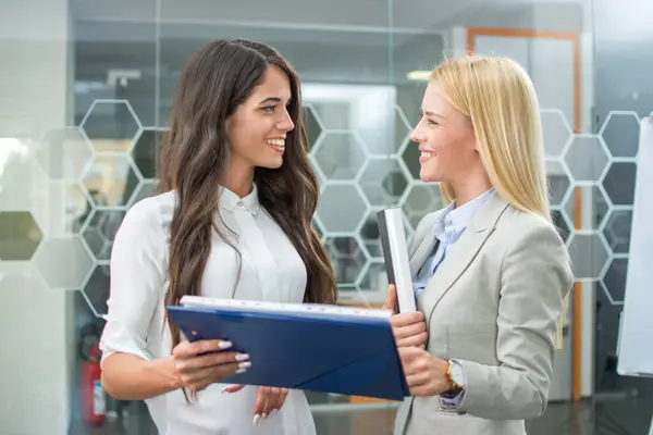 Smiling Business Women Reviewing Project Clipboard Modern Office — Stock Photo, Image