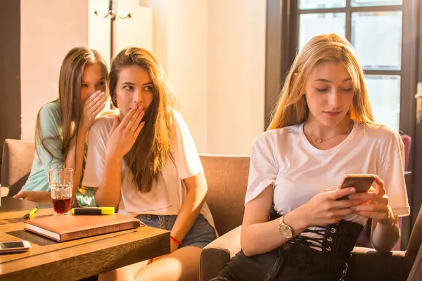 Teenage Girl Texting Mobile Phone Her Friends Gossiping Background — Stock Photo, Image