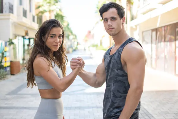 Sporty Couple Holding Hands Together Looking Camera — Stock Photo, Image