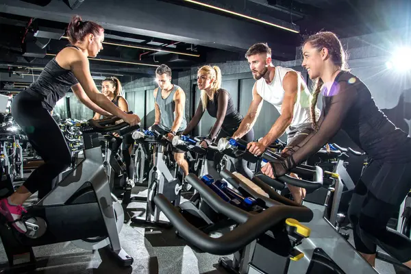Group Sporty Women Men Training Exercise Bikes Together Gym — Stock Photo, Image
