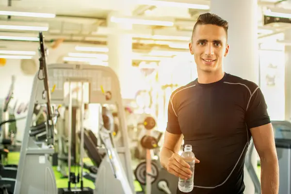 Happy Guy Holding Bottle Water Gym — Stock Photo, Image