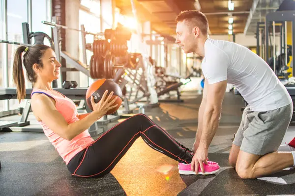 Sporty Girl Doing Crunches Fitness Ball Assistance Her Fitness Instructor — Stock Photo, Image