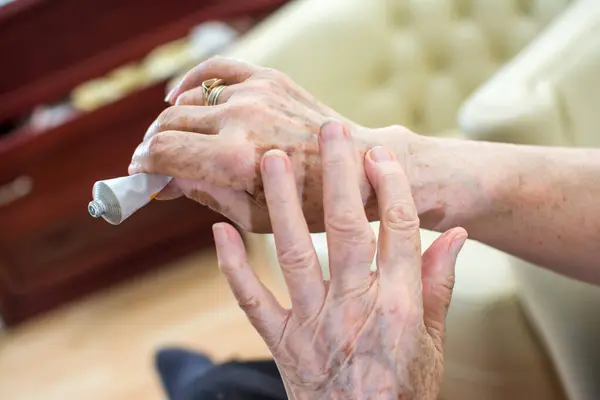 Close Wrinkled Hands Applying Cream Home — Stock Photo, Image