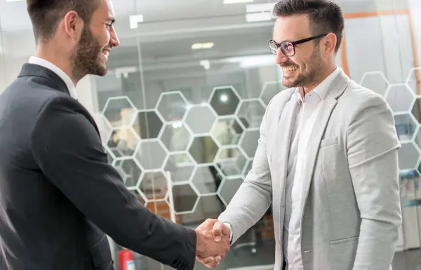 Two Confident Businessmen Shaking Hands Smiling While Standing Office — Stock Photo, Image