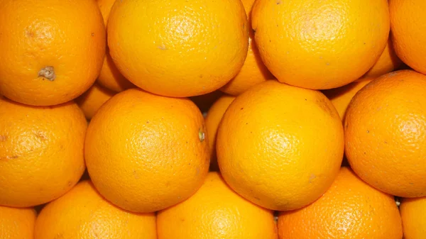 Fresh group of Mandarin oranges. pile of oranges in a fridge.